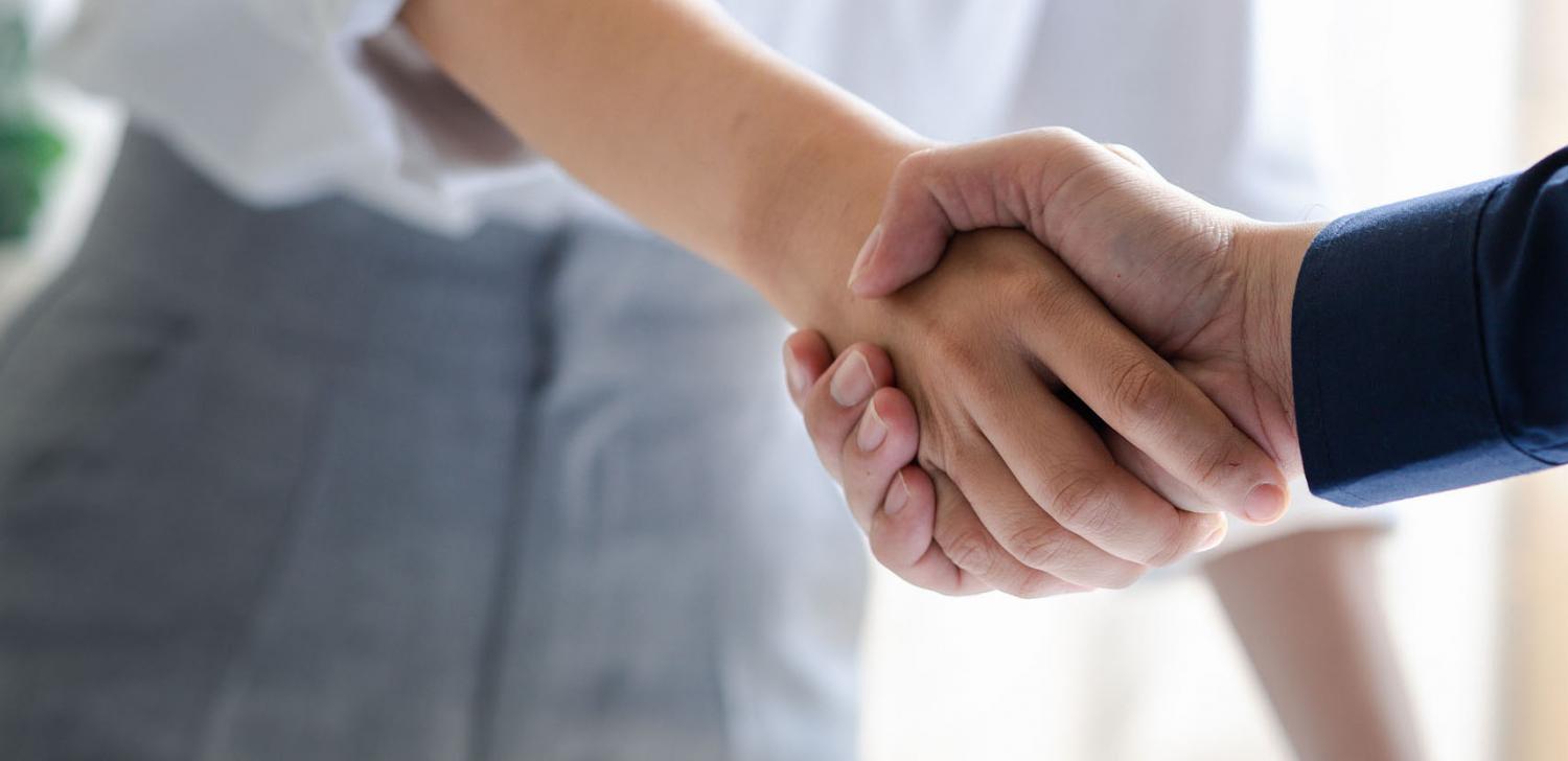 workers at an office shaking hands