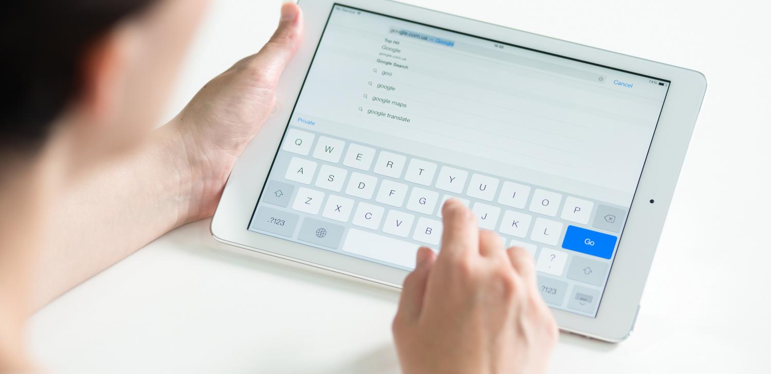 person typing on tablet